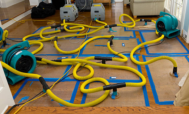 Professional Flood Damage Restoration technician working in Sheboygan Falls, WI